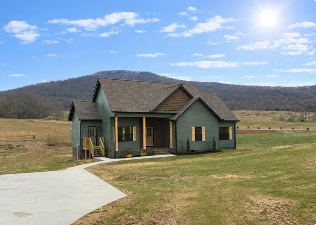 a view of a house with a garden