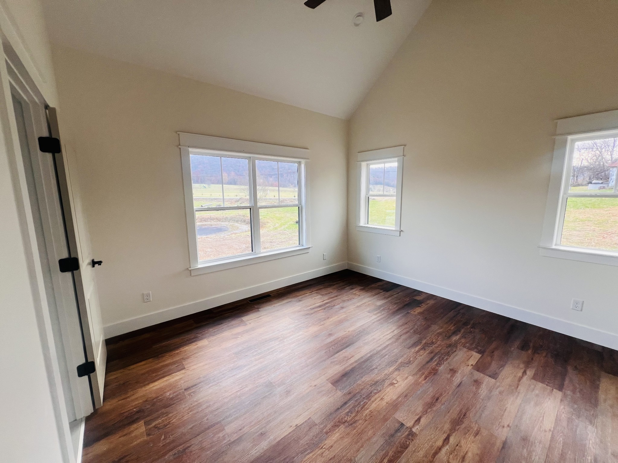 1769 Viola Road McMinnville, TN 37110 - Photo 17 of 27 an empty room with wooden floor and windows