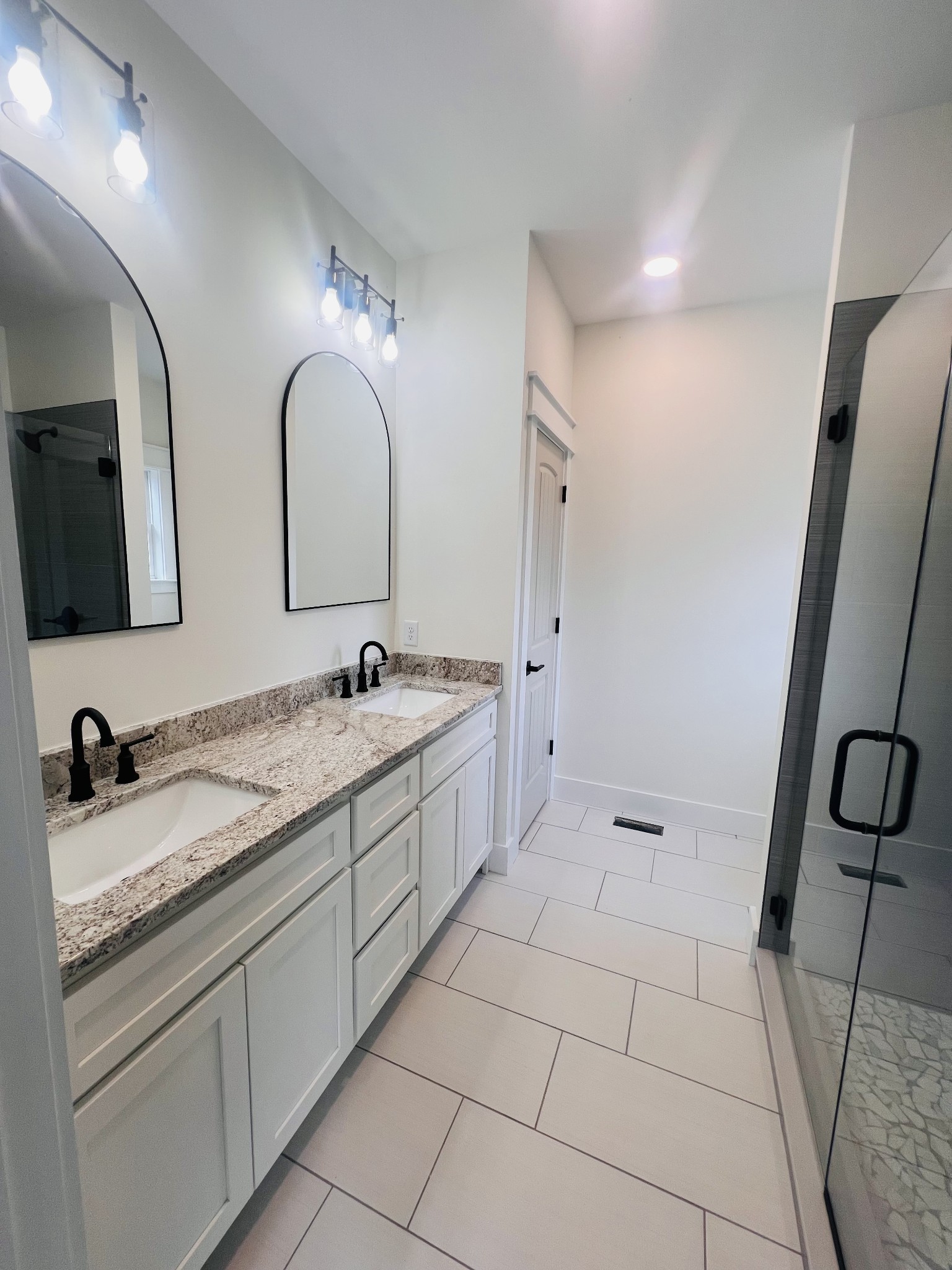 1769 Viola Road McMinnville, TN 37110 - Photo 18 of 27 a bathroom with a double vanity sink and a mirror