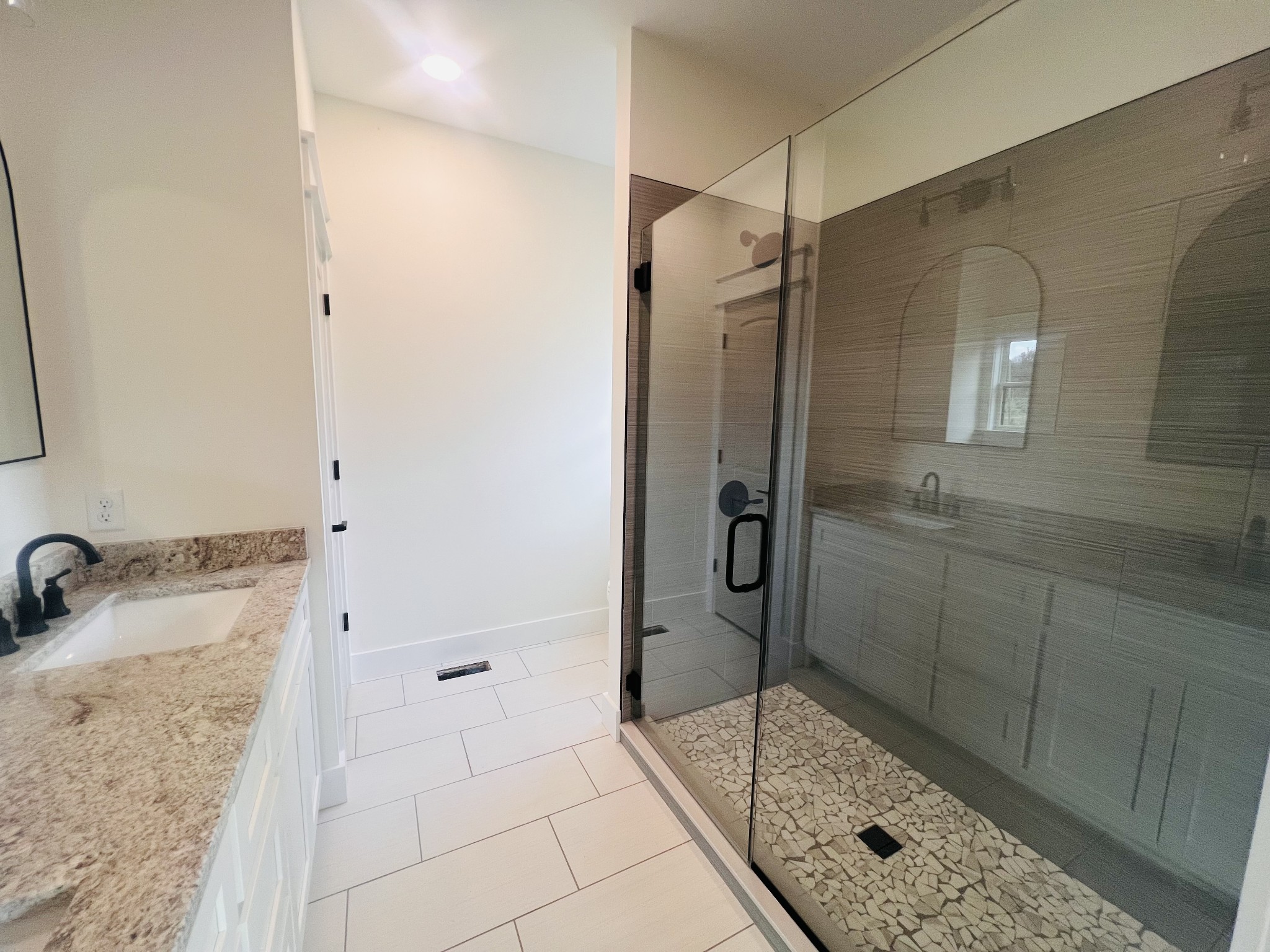 1769 Viola Road McMinnville, TN 37110 - Photo 21 of 28 a bathroom with a granite countertop shower mirror and a sink