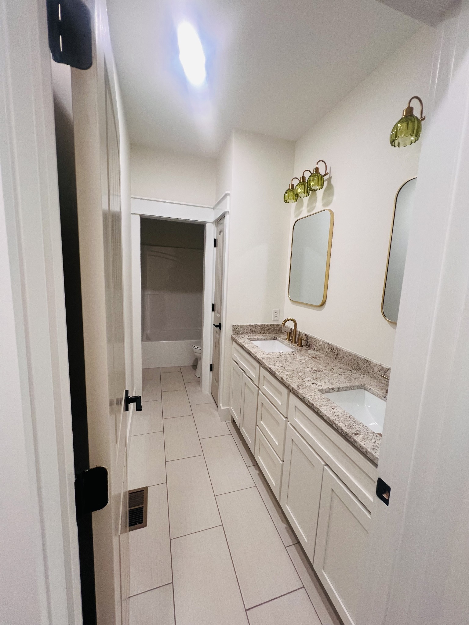 1769 Viola Road McMinnville, TN 37110 - Photo 23 of 27 a bathroom with a granite countertop sink and a mirror
