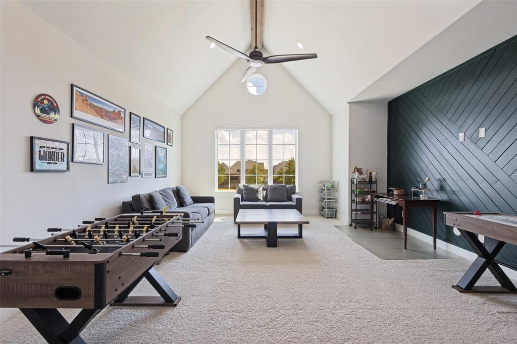 15018 Crape Myrtle Road Frisco, TX 75035 - Photo 13 of 40 Spacious living area featuring a vaulted ceiling, ceiling fan, and carpeted flooring