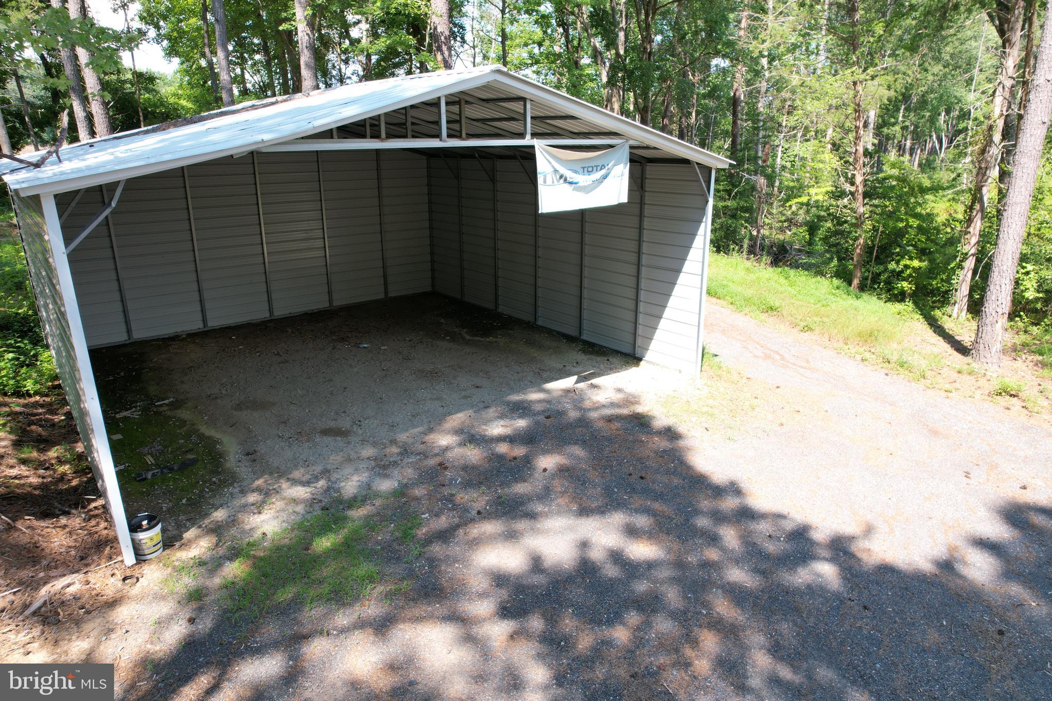 0 Countyline Church Road Woodford, VA 22580 - Photo 22 of 25 a view of backyard with barn and a large tree