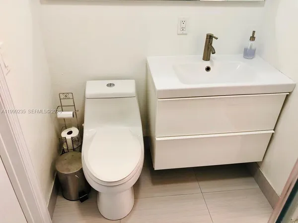 a bathroom with a sink and toilet