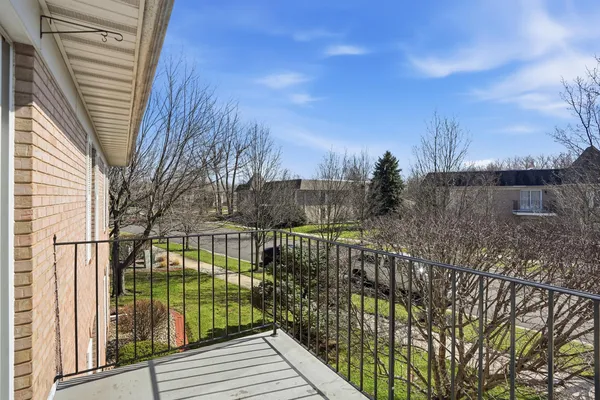 a view of balcony with wooden fence and floor