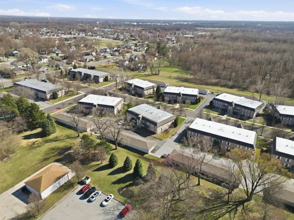 an aerial view of a house with a lake view
