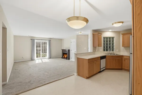 a kitchen with stainless steel appliances granite countertop a sink and a stove