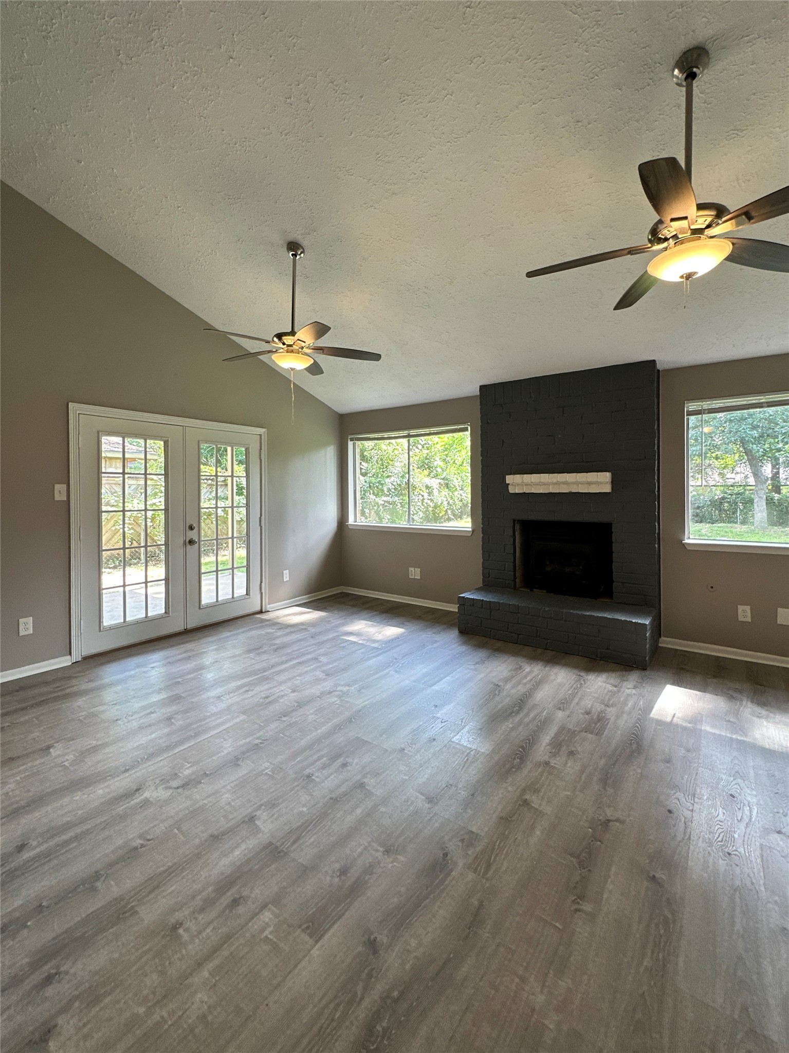 26403 Hunters Hollow Drive Spring, TX 77380 - Photo 22 of 34 Living room has access to covered patio and fully fenced backyard!