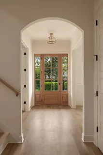 a dining room with furniture and wooden floor