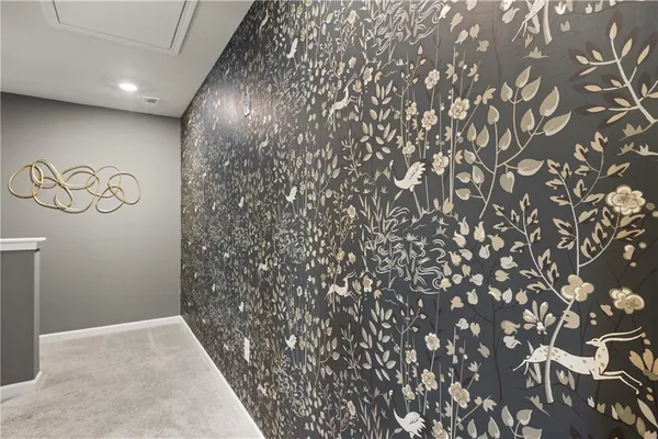 a en suite bathroom with a double vanity sink and a mirror