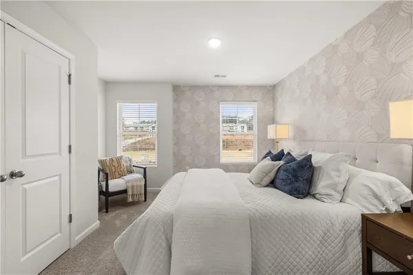 a living room with furniture and white walls