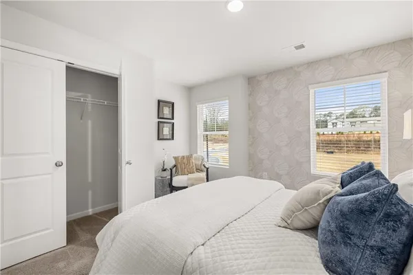 swimming pool view with a seating space and a garden view