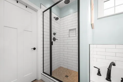 a view of walk in closet with clothes