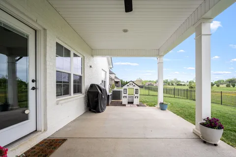 a front view of a house with a garden and porch