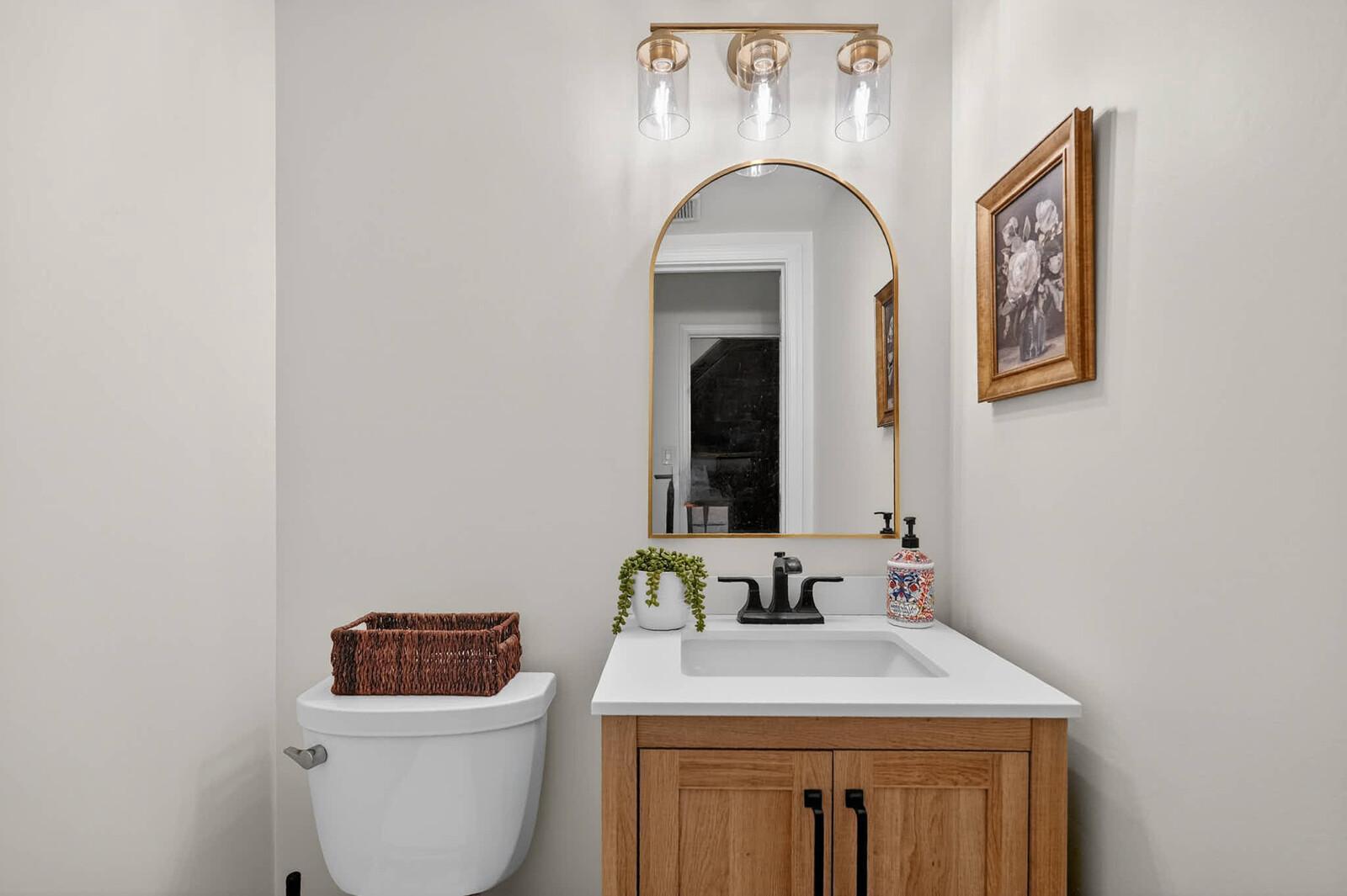 500 Finsbury Road Silver Spring, MD 20904 - Photo 15 of 54 a bathroom with a toilet sink and mirror