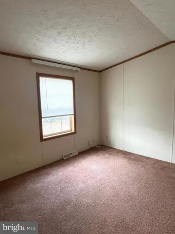 an empty room with wooden floor