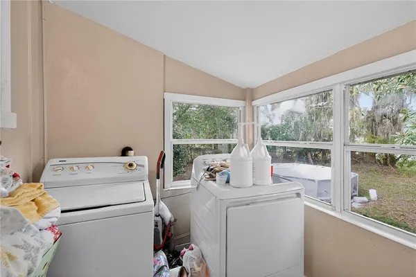 a room with a stove and a large window