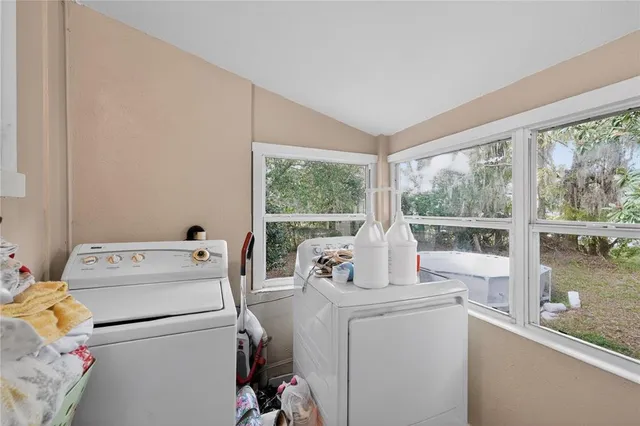 a room with a stove and a large window