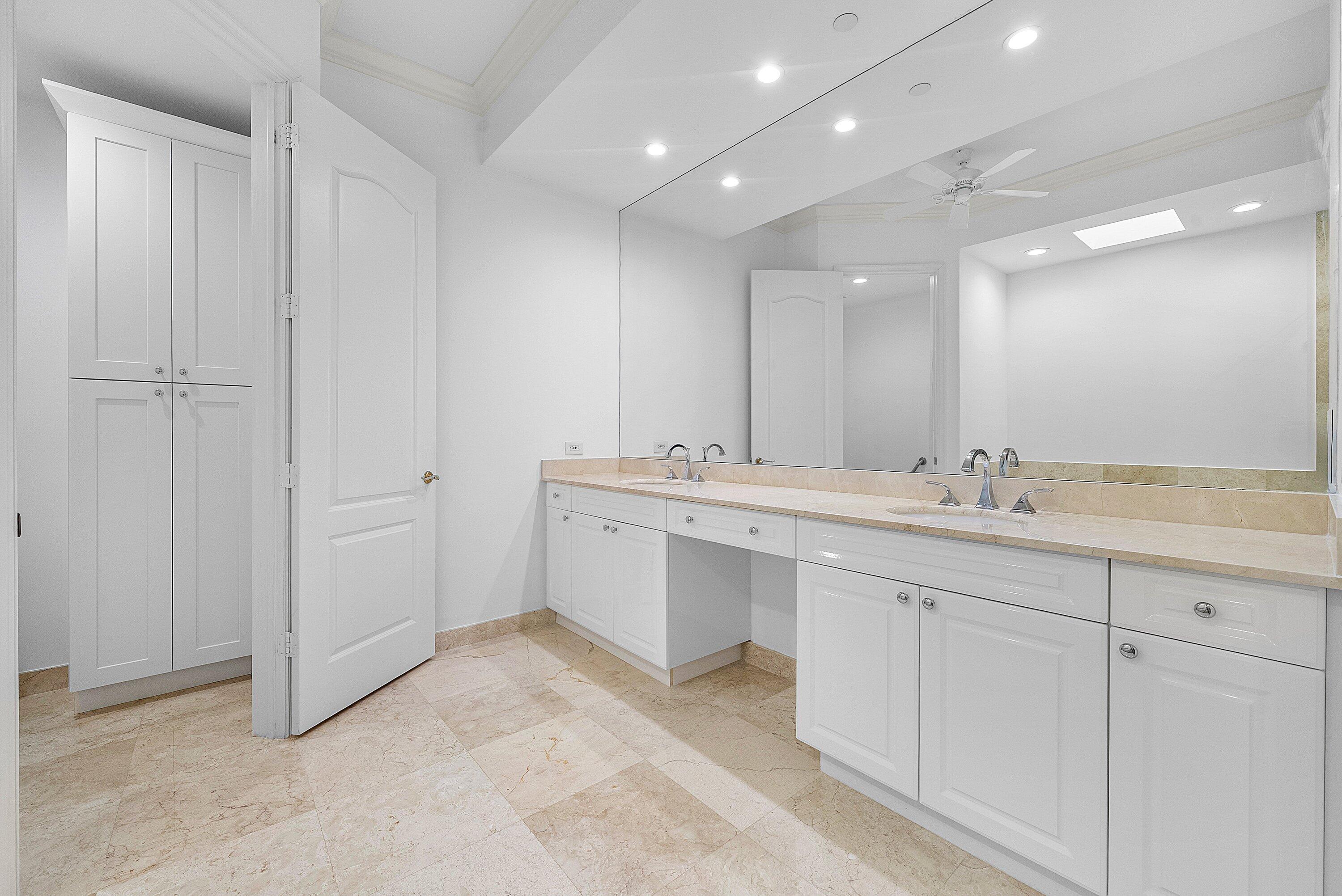 550 Southeast Mizner Boulevard, Unit B906 Boca Raton, FL 33432 - Photo 16 of 59 a bathroom with a double vanity sink and a mirror