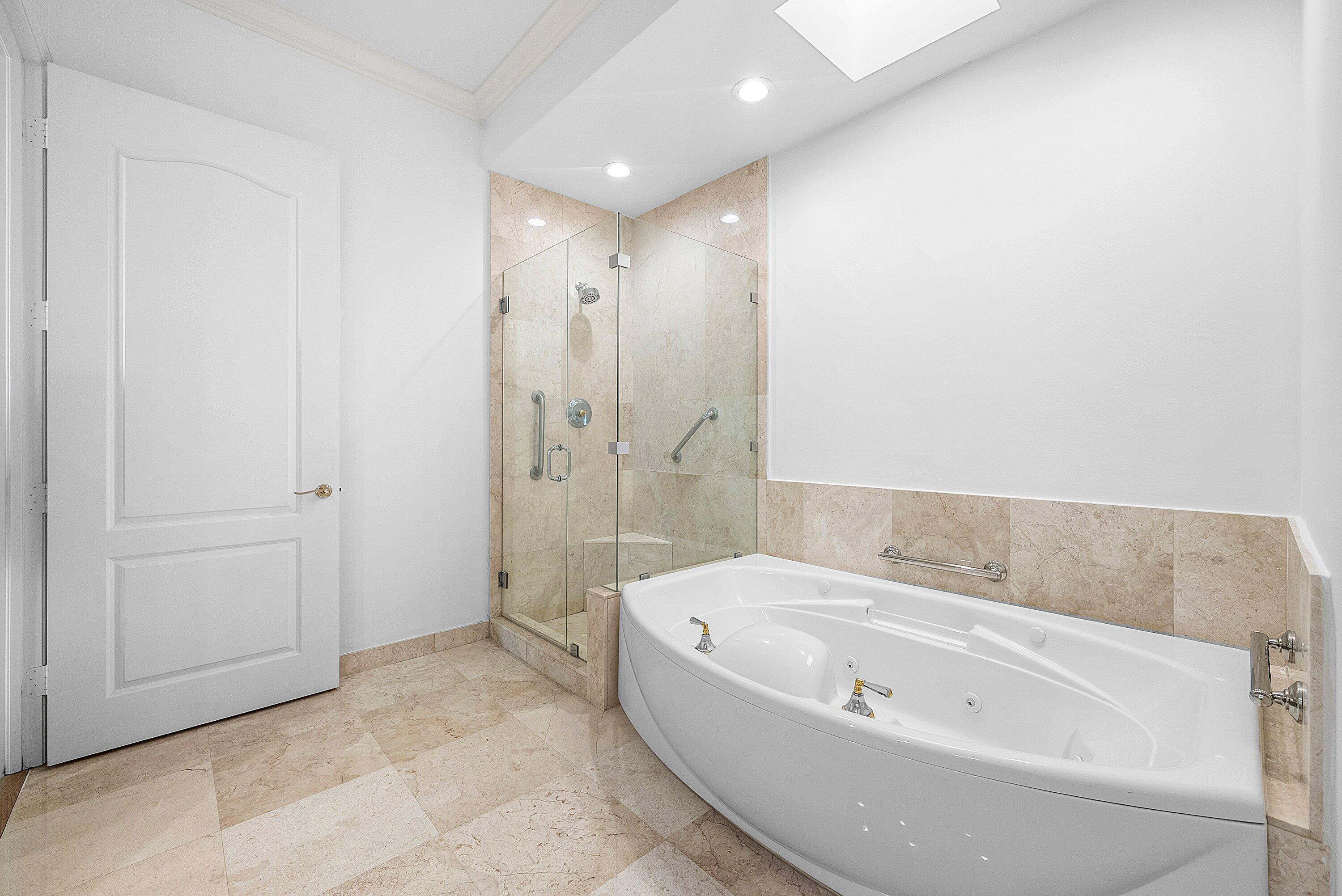 550 Southeast Mizner Boulevard, Unit B906 Boca Raton, FL 33432 - Photo 17 of 59 a bathroom with a bathtub and a shower