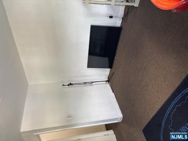 669 Scotland Road Orange, NJ 07050 - Photo 11 of 11 a bedroom with a bed and wooden floor