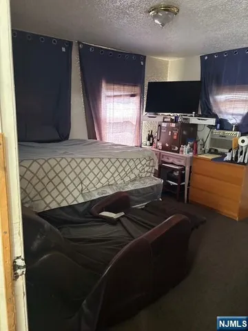 a room with furniture and a flat screen tv