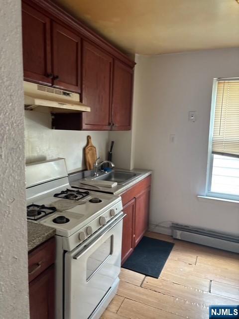 669 Scotland Road Orange, NJ 07050 - Photo 6 of 11 a kitchen with granite countertop a stove and a sink