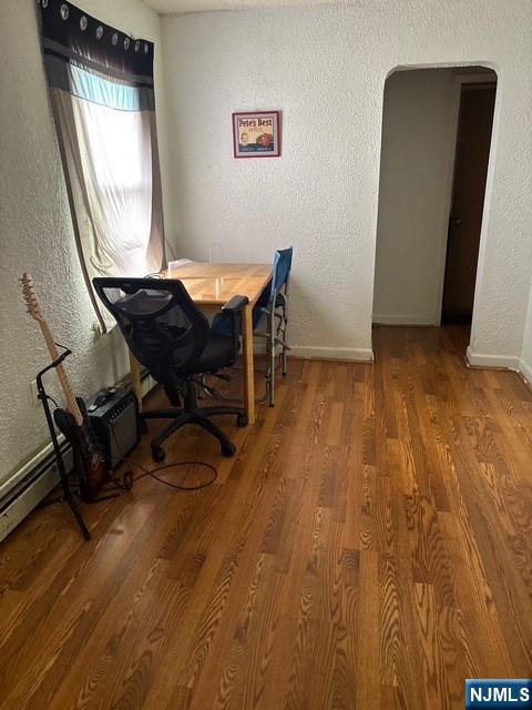669 Scotland Road Orange, NJ 07050 - Photo 7 of 11 a view of a workspace with furniture and wooden floor