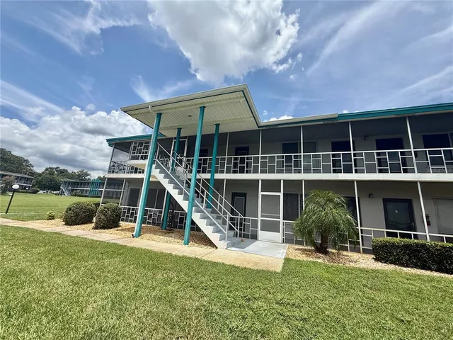 a view of a room that has a large window