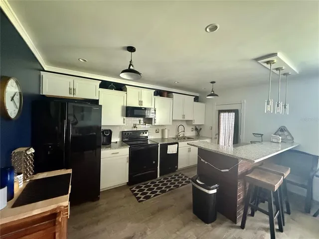 a kitchen with a refrigerator a stove a sink and dishwasher