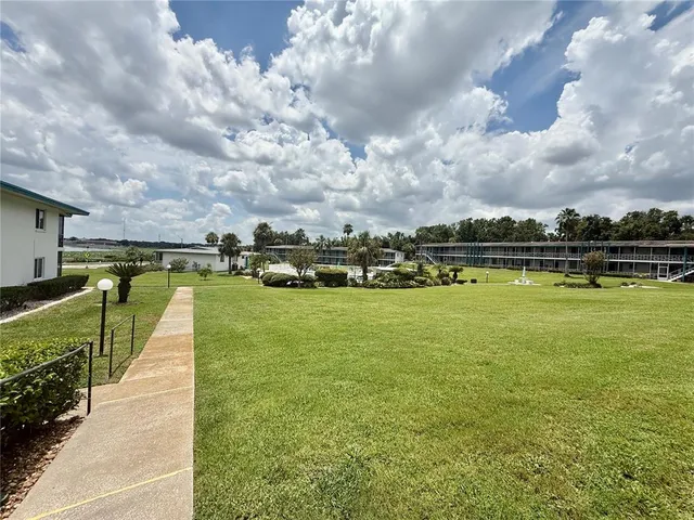 a view of a lake with a building in the background