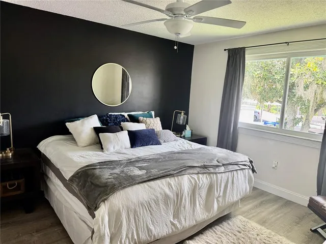 a bedroom with bed and a window