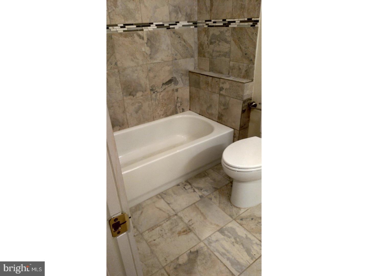 1005 South 8th Street Philadelphia, PA 19147 - Photo 13 of 13 a bathroom with a toilet and a shower