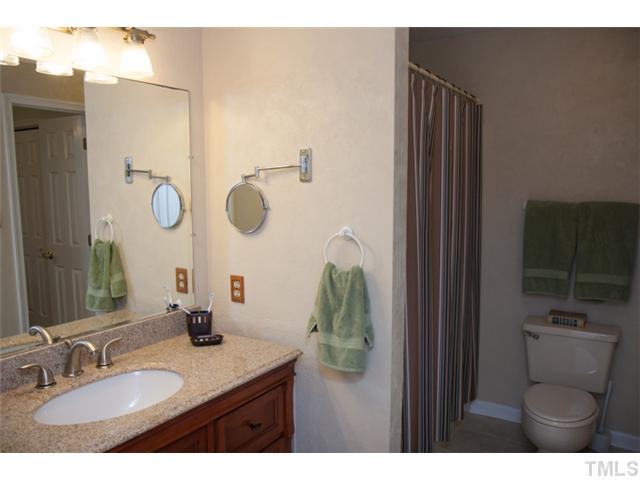 4041 Graham Sherron Road Wake Forest, NC 27587 - Photo 14 of 25 Comfortable master bath with granite countertop sink.