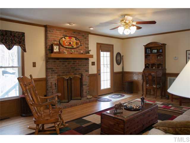 4041 Graham Sherron Road Wake Forest, NC 27587 - Photo 3 of 25 The Family Room. A gathering place for your family to enjoy those cozy winter nights by the fire. At 22' x 14' this room is hardly lacking for space. It's big! The large brick fireplace will warm most of home saving you a bundle on utility bills.