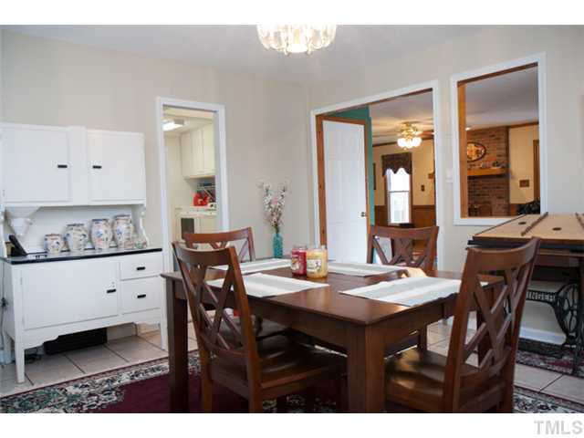 4041 Graham Sherron Road Wake Forest, NC 27587 - Photo 7 of 25 The Dining room opens up to the Family Room and the kitchen area. It brings the spaces together in a wonderful way.