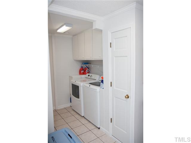 4041 Graham Sherron Road Wake Forest, NC 27587 - Photo 10 of 25 This first floor laundry room has plenty of space as well. There is lots of room for your laundry but also space for storage and an extra refrigerator or freezer.