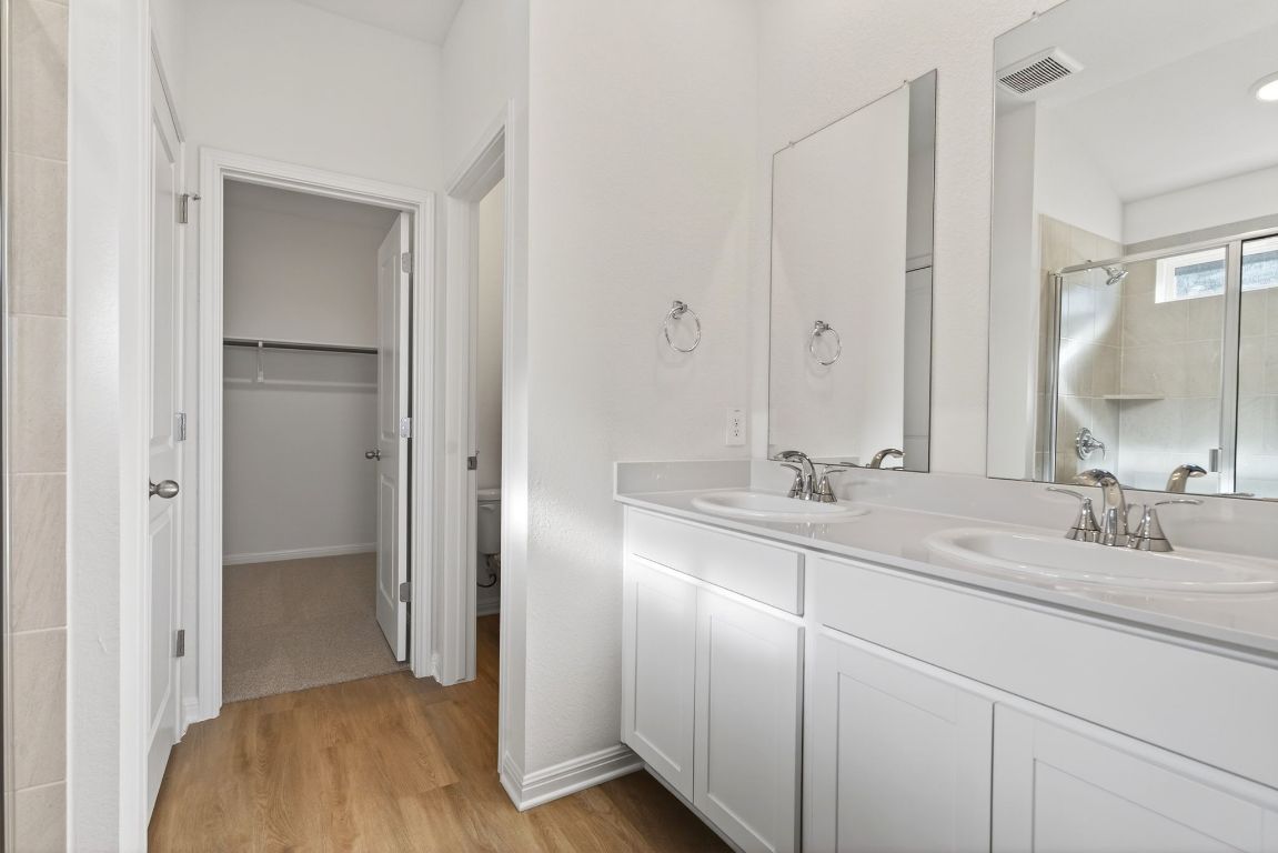 120 Honey Bee Road Jarrell, TX 76537 - Photo 12 of 20 a bathroom with a sink and a mirror