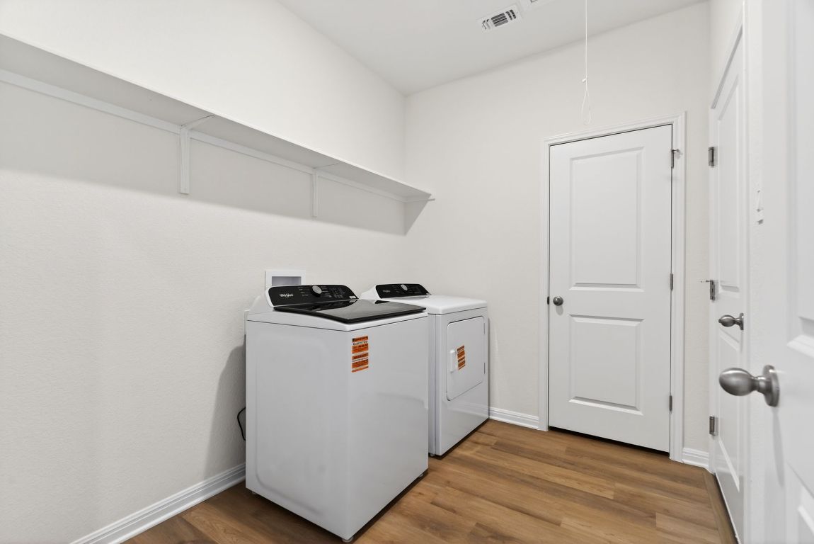 120 Honey Bee Road Jarrell, TX 76537 - Photo 17 of 20 a utility room with washer and dryer