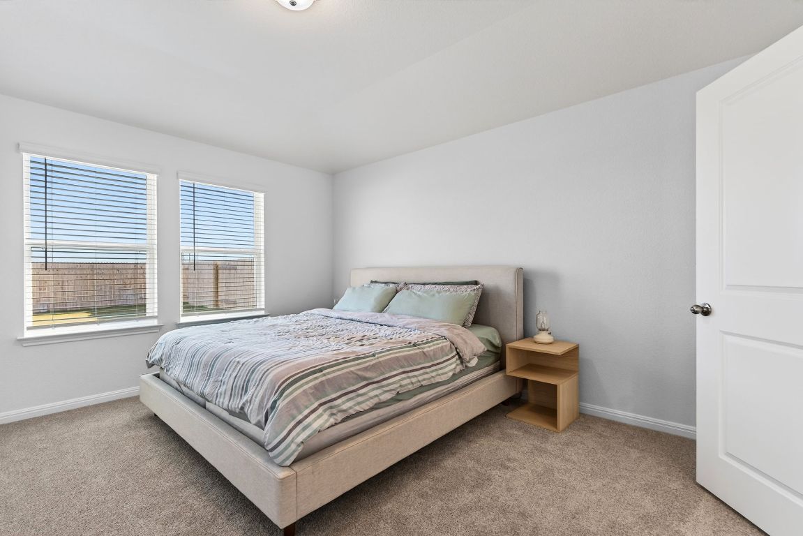 120 Honey Bee Road Jarrell, TX 76537 - Photo 9 of 20 a bedroom with a bed and a window