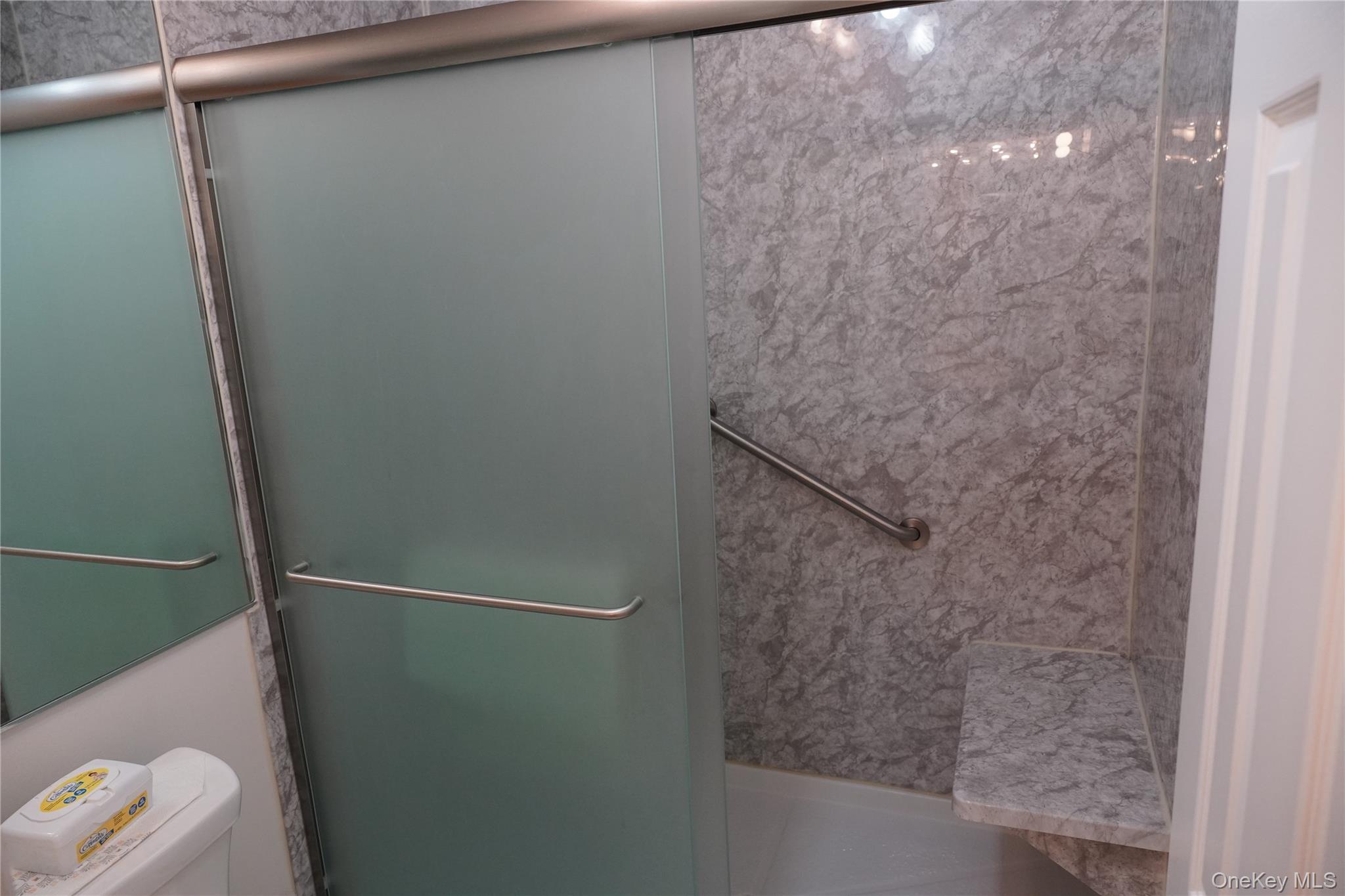 12 Baldwin Court Ridge, NY 11961 - Photo 13 of 15 a bathroom with a shower