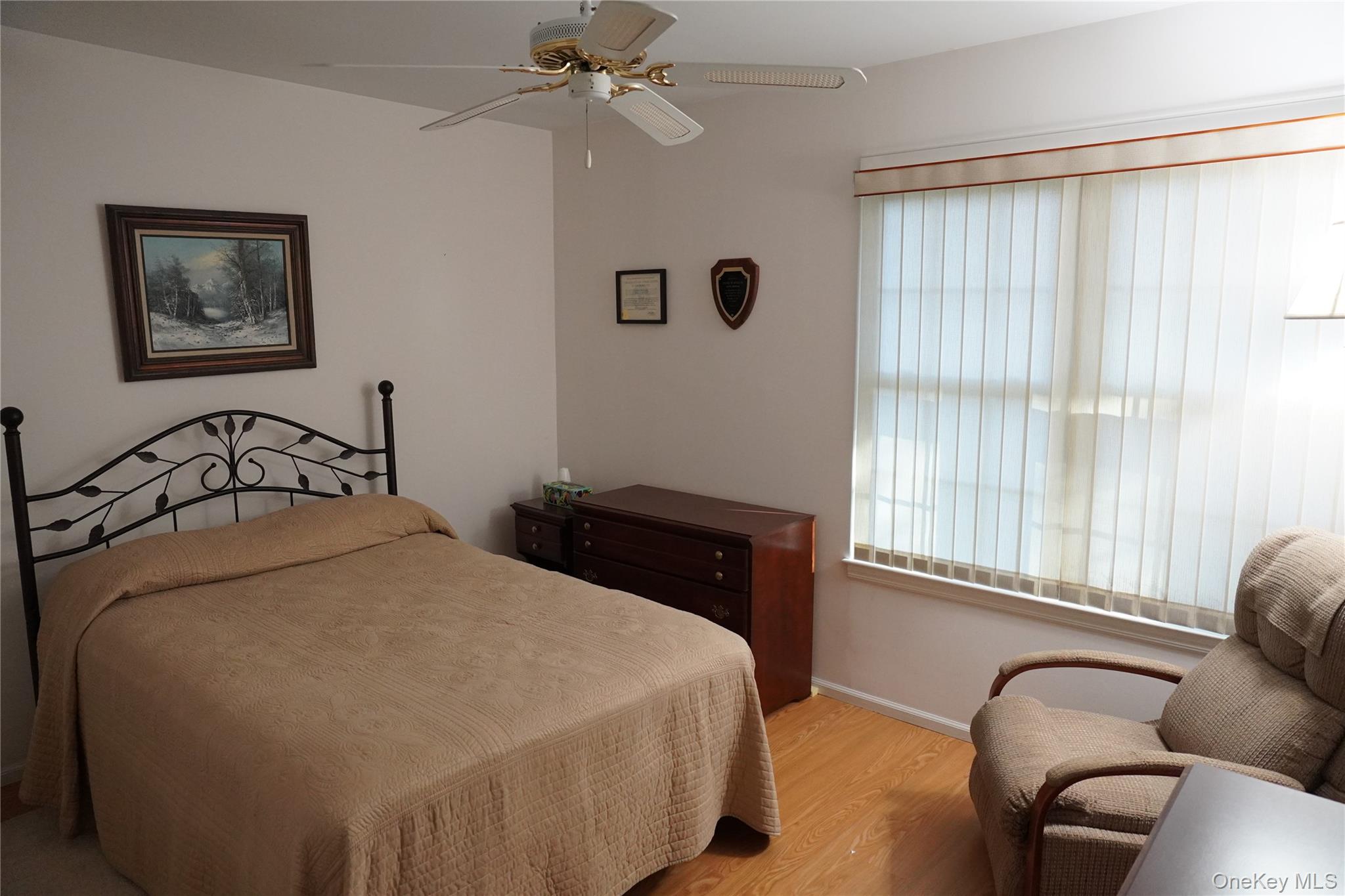 12 Baldwin Court Ridge, NY 11961 - Photo 14 of 15 a bedroom with a bed dresser and a window