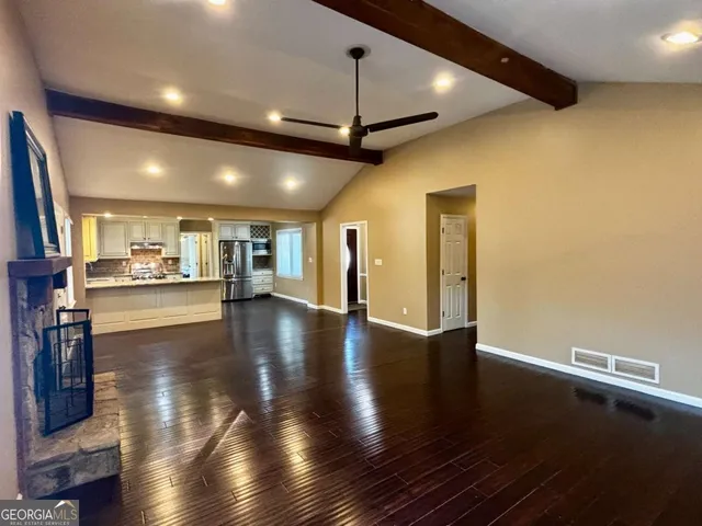 a view of a room with lots of wooden floor