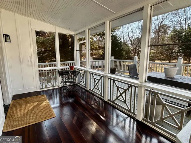 a view of a porch with wooden floor
