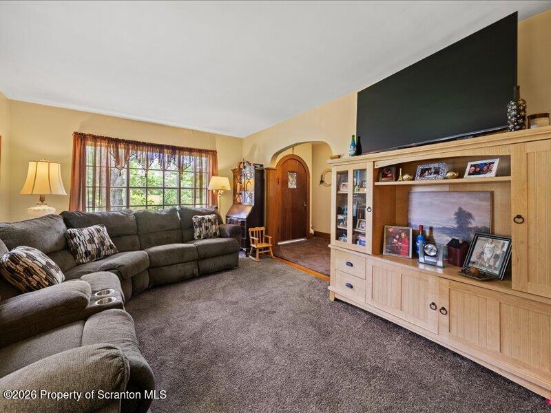 71 Pleasant Avenue Thompson, PA 18465 - Photo 6 of 37 a living room with furniture and a flat screen tv