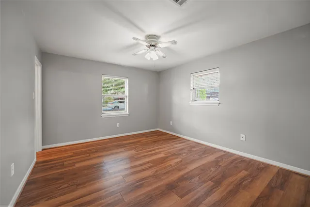 a kitchen with a refrigerator and cabinets