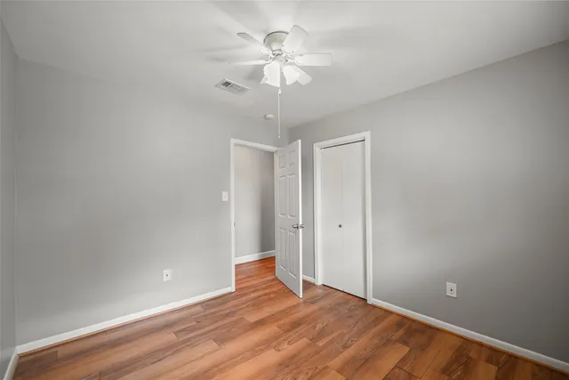a bathroom with a sink vanity and toilet