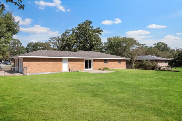 a view of a park with large trees