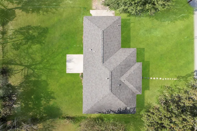 a view of a field with trees