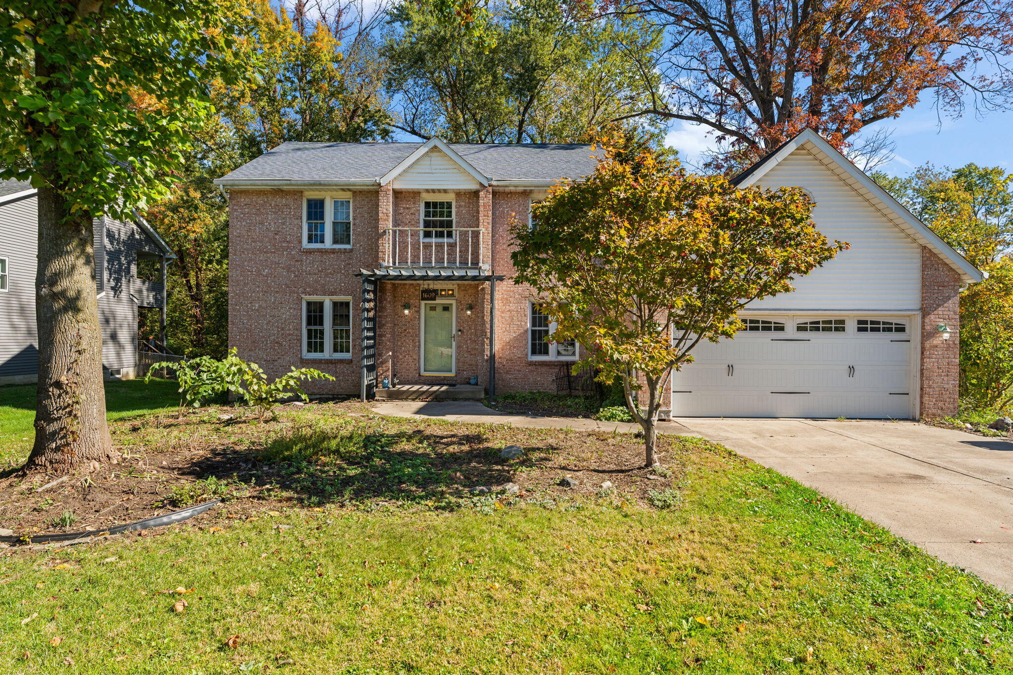 a front view of a house with garden